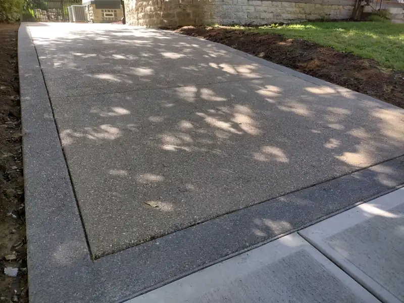 Refinished concrete patio surface with a smooth border band