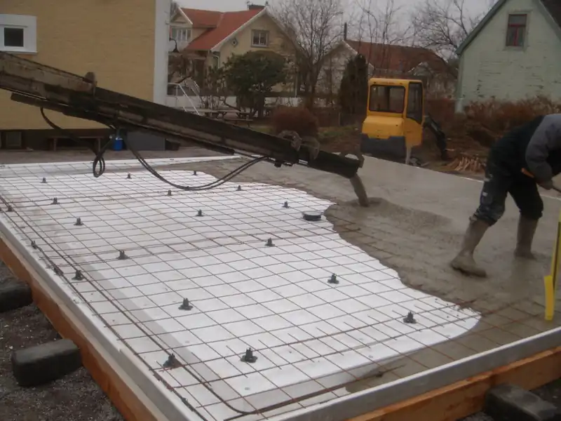 Foundation forms with a grid of reinforcing laid out before the pour