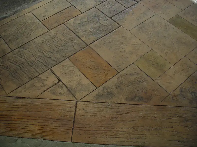 Close view of an ashlar stone pattern stamped and stained into concrete